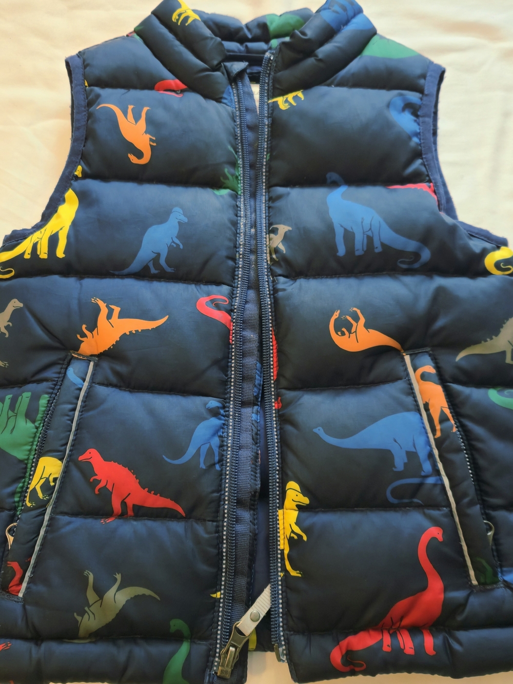 Hanna Andersson Navy Dinosaur Puffer Vest with Bright Multicolor Dinosaurs